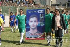 Mahmoud al-Sarsak's team mates at Khadamat Rafah Football Club hold a poster of him calling for his release